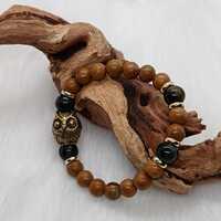 Bracelet "hibou" en bois fossilisé et œil de faucon