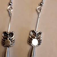 A Tibetan Silver Owl Sitting on an Imitation Spring Earrings with Silver Wires.