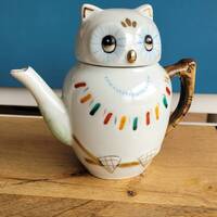 Vintage quirky teapot in style of an owl