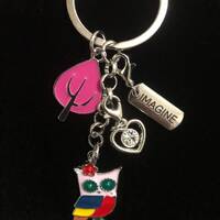 Keychain with owl, tree, silver heart with gem and imagine tag.