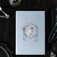 Hardcover Journal with a beautiful snowy white owl on the cover surrounded by flowers and feathers