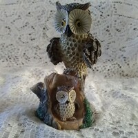A 4" tall brown toned Mama horned owl watching over her baby in the hollow of a tree stump.  Mi