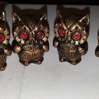 4 Ceramic owls with gem eyes one chipped good condition