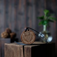 Tribal Style Owl Necklace/Pendant. Made from solid sycamore wood. Round shape. Brown color. Adjustab