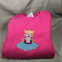 Embroidered glow in the dark owl sitting on flower on brand new pink crewneck child sweatshirt