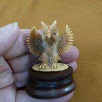 little tan owl with wings outstretched flapping tagua nut figurine Bali detailed carving display lov
