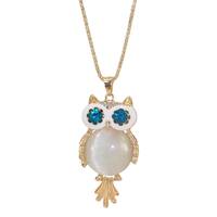 White owl pendant necklace with a round white cat eye stone center, blue crystal eyes, clear crystal