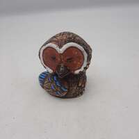 Decorative stoneware owl figurine orange and turquoise glaze accents