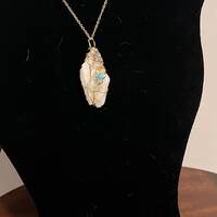Crystal large, wrapped in gold wire with owl charm . Pendant necklace