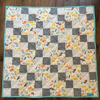 Baby deer, squirrels, owls, and othe forest animals are so cute in this cozy quilt with gray and aqu