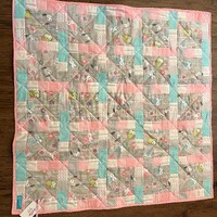 Baby owls in pretty pastel colors are so adorable in this baby quilt. They are framed with pastel po