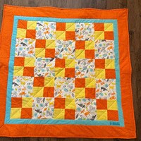 Baby deer, squirrels, owls, and othe forest animals are so cute in this cozy quilt! Bright orange an