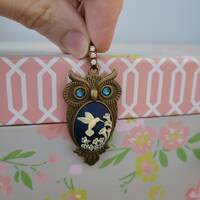 Darling vintage brass owl pendant with rhinestone bail and eyes, hummingbird and trumpet lily flower