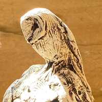 Owl on standing stone sculpture by Paul Szeiler