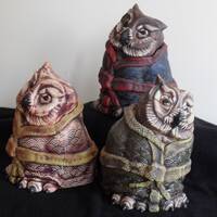 Three stoneware owl jars