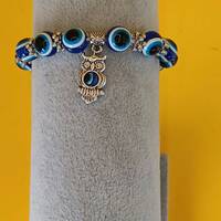Owl with  tigers eyes bracelet.
