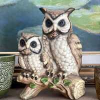 2 owls on branch. mom and baby.