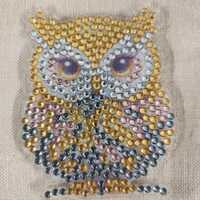 Pretty owl magnet. Very sparkling.