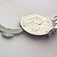 Keychain. A coin with a silhouette of a owl
