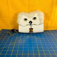 Bioworld cross body Harry Potter Hedwig the owl purse with letter charm has small pen mark on side a