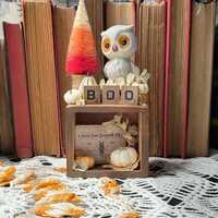Vintage porcelain owl Halloween decoration. Sits atop a vintage spice drawer filled with pumpkins an
