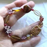 Rustic owl, heart, flower bracelet. Czech artisan glass. Beautiful. Amber, deep red. 1 of a kind. 6.