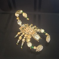 Gold and Emerald Owl Scorpion
