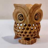 An owl one pieces ,three inches  with a child in the net ( Stomach).