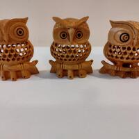 An owl family consisting of three pieces, each measuring three inches each with a child in the net (