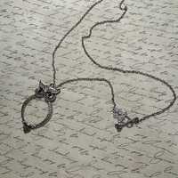Magnifying glass owl pendant