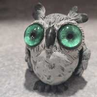 Little green eyed Grey Owl