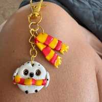 Harry Potter&rsquo;s owl, Hedwig, and griffindor scarf