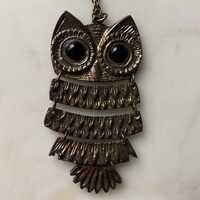 A large and striking vintage bronze articulated owl pendant and chain.