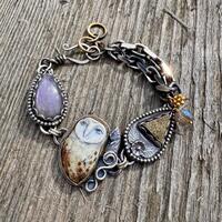 RESERVED.             L&aacute;pis, silver, gold, and porcelain owl bracelet
