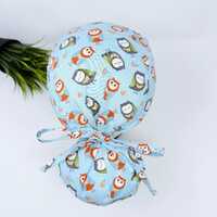 Owl Ponytail scrub cap for women with satin lined option by Paradise Caps.