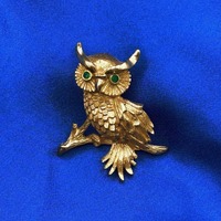 Vintage Monet Gold Tone Owl Brooch with green rhinestone eyes, ca 1960s-1980s