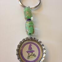 Witchy Owl Keychain With Silver Bottlecap with A Witch Owl and Green and Purple Beads