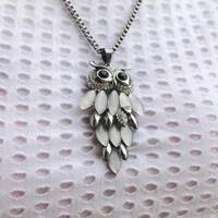 Owl made of metal and quartz ,with black stones eyes,long Necklace fine for a gift
