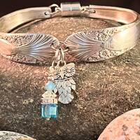 Silverplated Silverware with Owl Charm and Blue Charm and Magnetic Closure