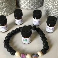Lava Stone Diffuser Bracelet: Hematite Owl, Howlite, Essential Oil Blend