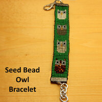 Owl Seed Bead Bracelet. Multi colored owls on a green background. Chain extension. Birthday or frien