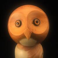 Handcrafted Yew Wood Snowy Owl Sculpture: Tilting Head Design