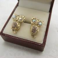 A super fun pair of sitting owl costume jewelry pierced earrings made in shiny goldtone  metal set w