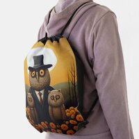 Suited Owl and Offspring in an Orange Twilight Drawstring Bag